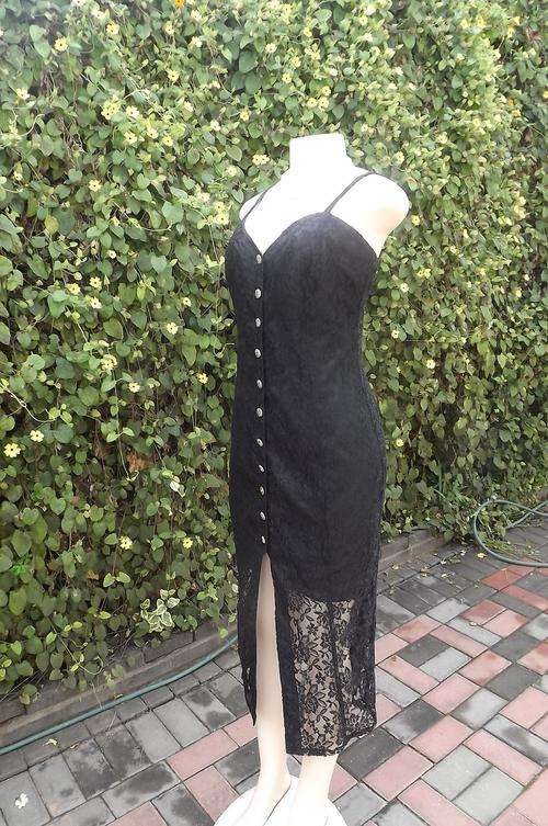 Sexy black lace dress from Truworths in size 38/14.Button down front.Thin shoulder straps.Maxi lengt