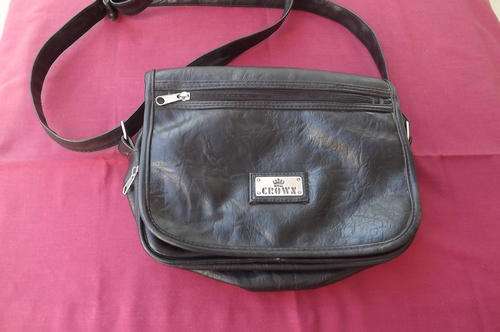 Black Crown sling bag in good condition with 4 zips for storing