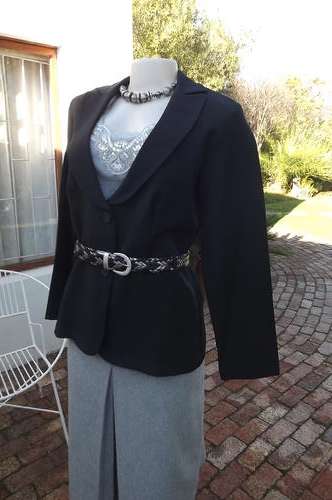 Black Tuxedo type ladies jacket by Truworths in size 38/14.Button down front.Can wear with/without