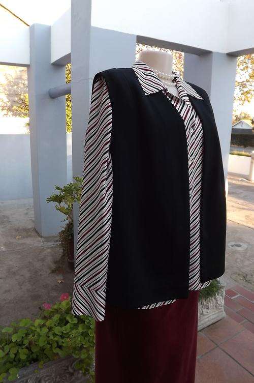 Black vintage open waistcoat in size 38/14.Boutique made.Good condition.Fabric resembles crimplene