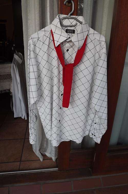 White with black diamond pattern Truworths Man shirt.Size 44.Chest 125cm.We added a narrow red tie!