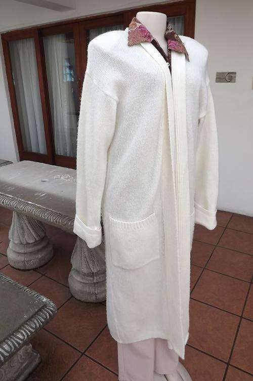 Cream acrylic knitted long coat.Loose hanging.Best fit size 42/18.Extra long fold over cuffs sleeves