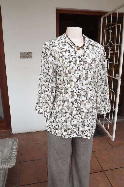 Charming block patterned beige/brown top by Milady's in size 36/12.Tailored with 3 quarter sleeves.