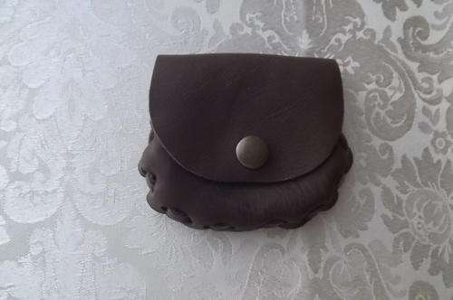 Genuine leather small handmade purse closing with press button.Brown.Nice and soft for your change.