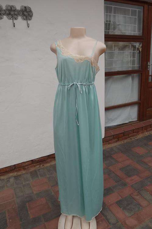 Silky light turquoise long nighty by"It's a Pleasure"size Medium.Sexy nighty with elasticated middle