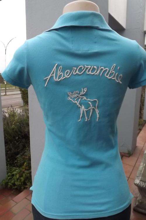 Ladies Abercrombie golf shirt with cap sleeves in blue.Size 32/8.100% Cotton.Good condition