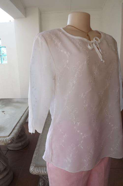 Beautiful white sheer embroidered sheer polyester Cool Ice loose top size 36/12.Peephole on front wi