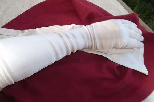 Pair of long stretch cream satin gloves for special occassion.Size Medium by Ladicape.As new