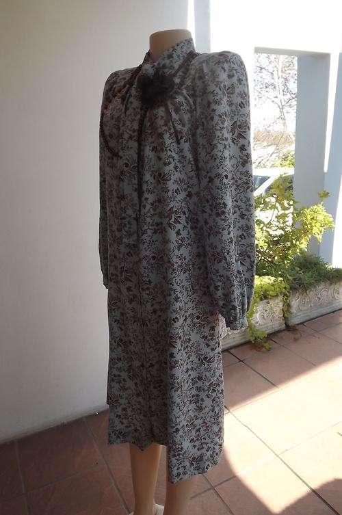 Soft blue polyester dress with brown butterfly design.Boutique made size 38/14.Rounded yoke.Good con