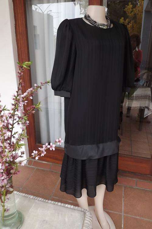 Elegant black dress with dropped waist.Lined by Top Chic size 38/14.Double layer skirt.New condition
