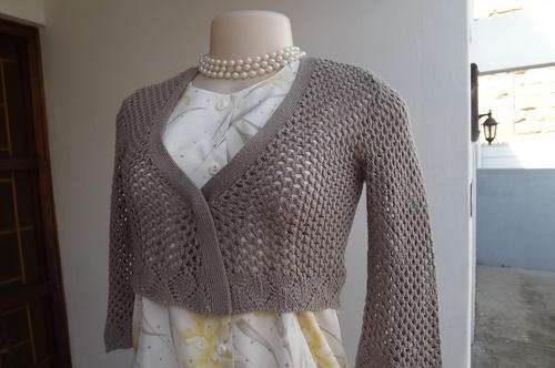 Short dark beige acrylic knit bolero in lace pattern by Legit size 30/6.Close with button on front.