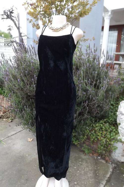 Black sleek lined velvet dress with thin shoulder straps size 32/8.Fully lined.Good condition