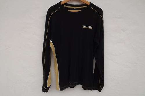 Black Habegger men's top with mustard inlay at side in size Large 118cm chest.Raglan sleeves.