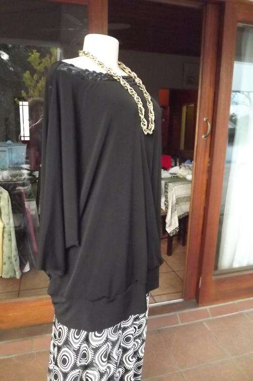 Glamorous black Donna Claire size 48 24 top.Suitable for evening wear.Embellished decoration on neck