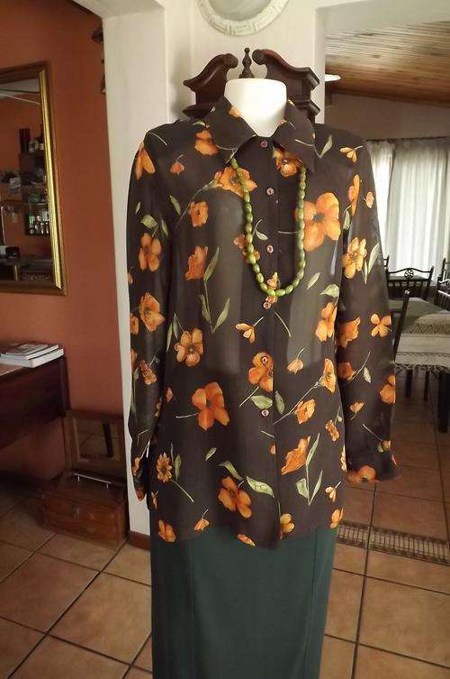 Choc brown long sleeve 100 rayon blouse with orange flowers.Size 36/12 from Truworths.Good condition