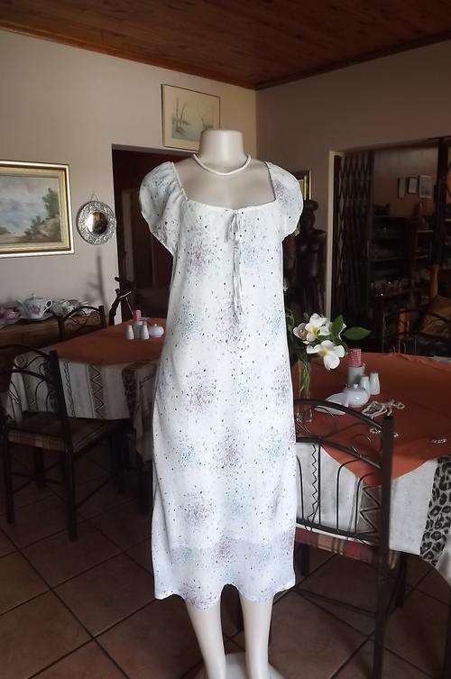 White lined sheer polyester shift dress with wide elasticated neckline and sleeves.Size 42/18