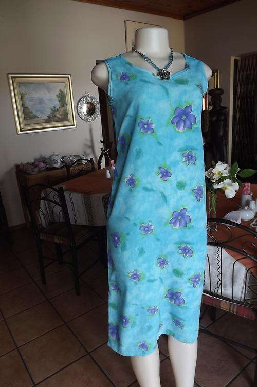 Turquoise polyester shift dress with rounded neckline.Size 32/8 by Girls Unlimited.Good condition