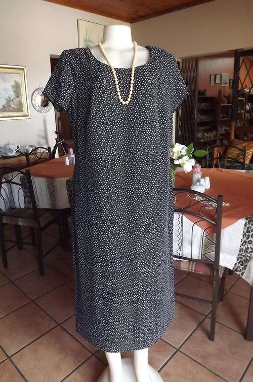 Chemise black lined dress with tiny white flowers by Penny C size 42/18.Rounded neckline