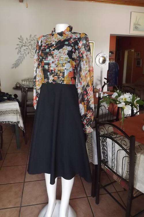 Vintage dress with black A line skirt and sheer glamorous floral top with gold glimmer.Size 33/9.