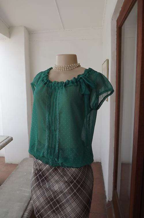 Pretty sheer turquoise top with feminine detail in size 34/10.Wide rounded neckline with dawstring