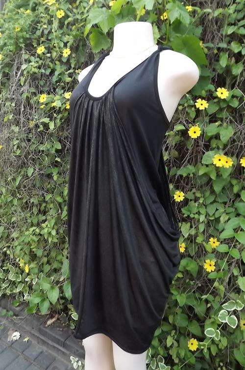 Black fashionable short dress with flowing overlay and gold glitter surface.Size 36/12.