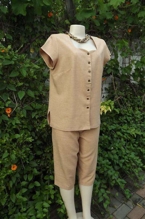 Caramel colour two piece casual cropped pants and top.Size 40/16.Neatly made by previous owner.