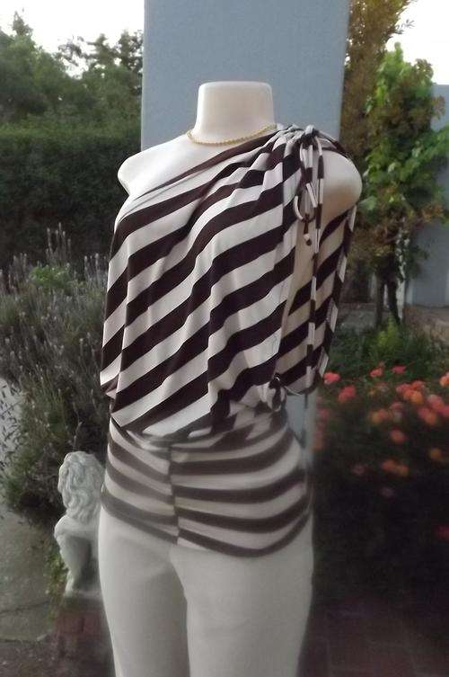 Brown and beige off shoulder sexy top.Wide band over hips.Size 34/10.In stretch polycotton.
