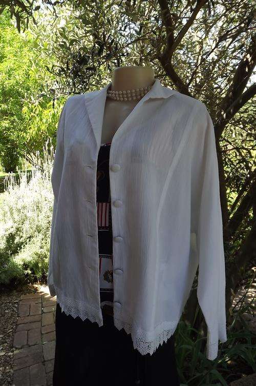 White button down jacket/top with dolman sleeves.Size 40/16.Made by previous owner.Good condition