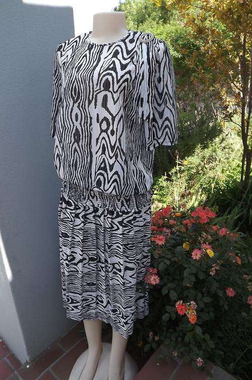 Animal Print 2 Piece Suit size 10/34 by Topics in Black & White Poly/Rayon Fabric - as new