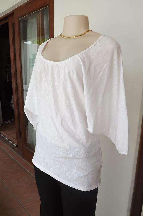 Excellent quality 100% cotton textured top size 36/12 by "Poetry".Elbow length dolman sleeves.