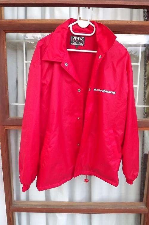 Red nylon Honda Racing Windbreaker jacket with press button front.Size Large by Apex.2 Front pockets
