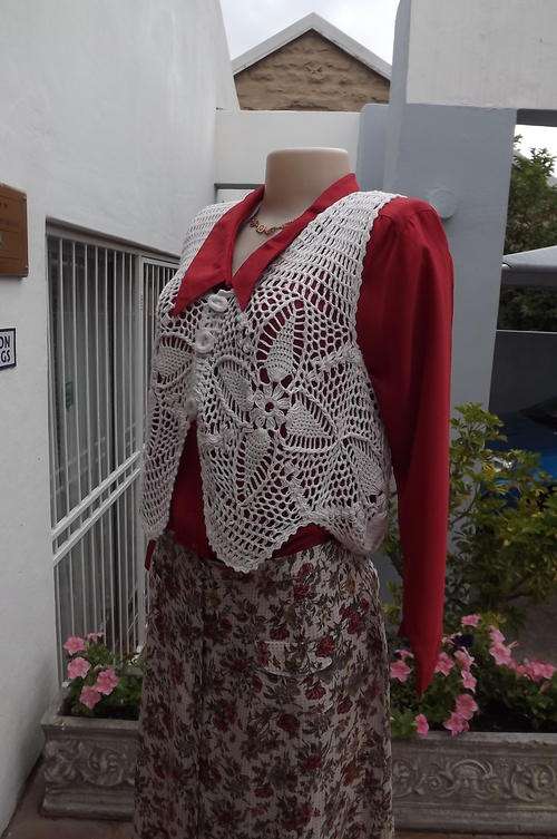 Beautiful cream cotton hand crocheted waistcoat with 3 buttons on front. Size medium.