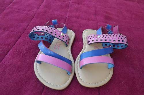 Cute pair of sandals for small girl size 2 by Tiptoes. In pink and blue with ankle straps. New cond.