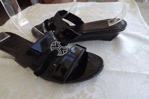 Pair of black sandles in size 8 with low wedged heels.By Woolworths.New condition.