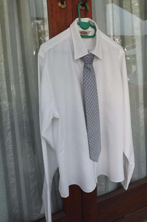 White polyester Men's shirt with embroidered front.Size large by Network.Long fold over cuffs.