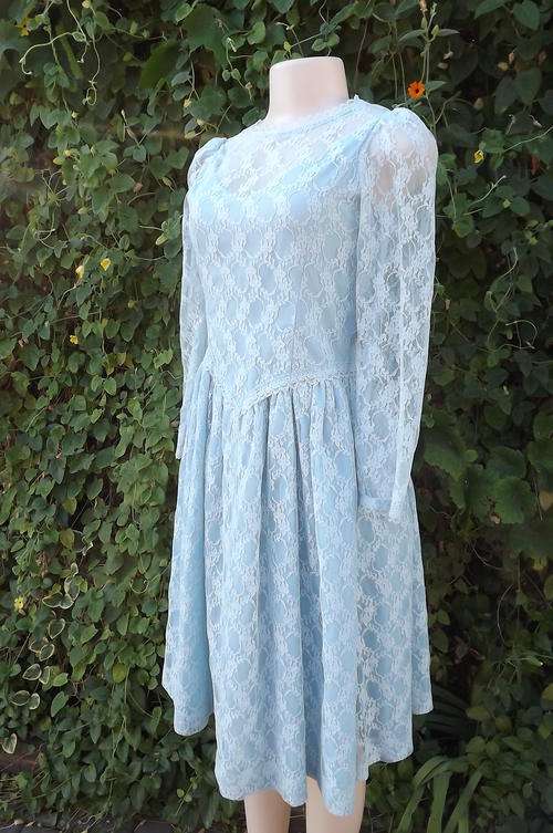 Soft blue acrylic lace special  occasion long sleeve dress.Size 30/6.Wide gathered skirt.