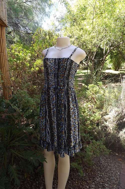 Soft stretch polyester strappy dress in blue and yellow floral stripe pattern.Size 34/10.Good cond.