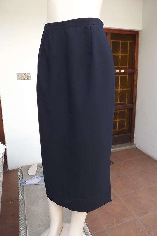 Elegant long navy pencil skirt with slitted sides.Maxi length.Size 40/16.Hips 113cm.Firm polyester
