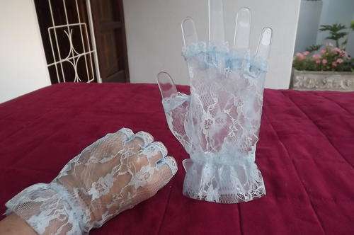 Pair of baby blue lace fingerless gloves in size Medium by Chic.New-Never used