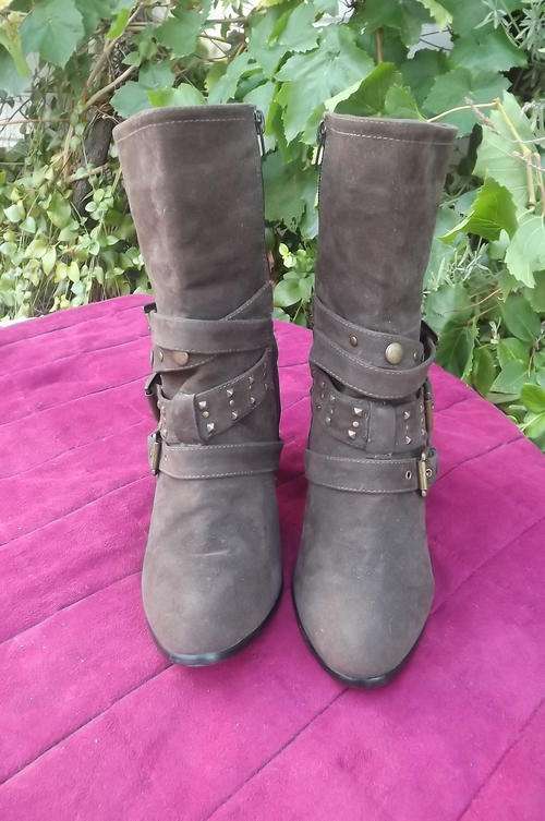 Pair of brown high heel Suede look short boots.Size 8 by fashion Express.Buckle and stud decoration