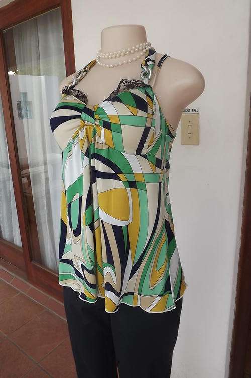 Halter neck stretch polyester top with build in bra.Size 34/10 by Luccica.Metal chain decoration.