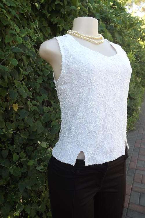 Pretty cream nylon blend lace top in size 36/12. Front lined. Back see-through.