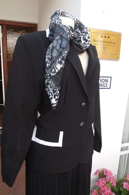 Elegant black fitted jacket with button down front. Size 40/16 by Fashion Express