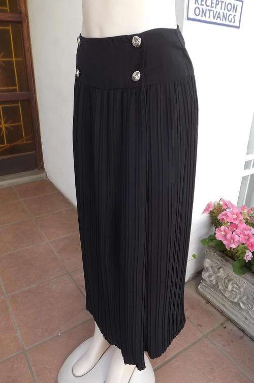 Fabulous black permanent pleated fold over skirt by Truworths in size 36/12
