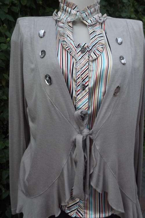 Smart long sleeve beige top with rounded front, in size 38/14 by Fengo. In good condition