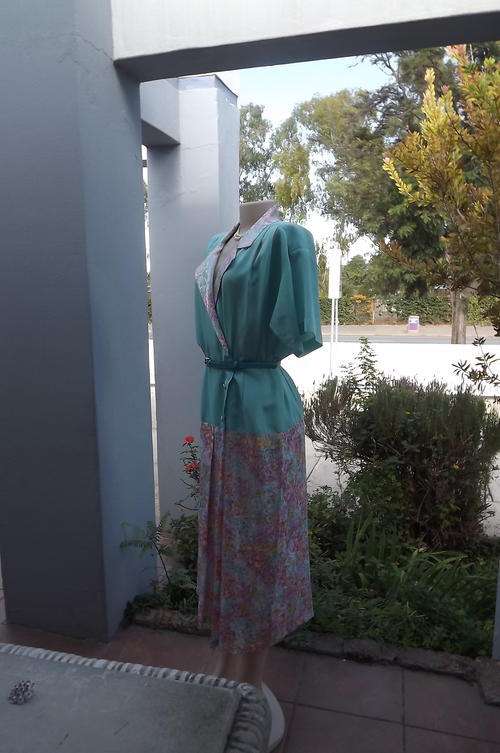 Vintage dress in turquoise and floral silky polyester.Size 40/16.Boutique made