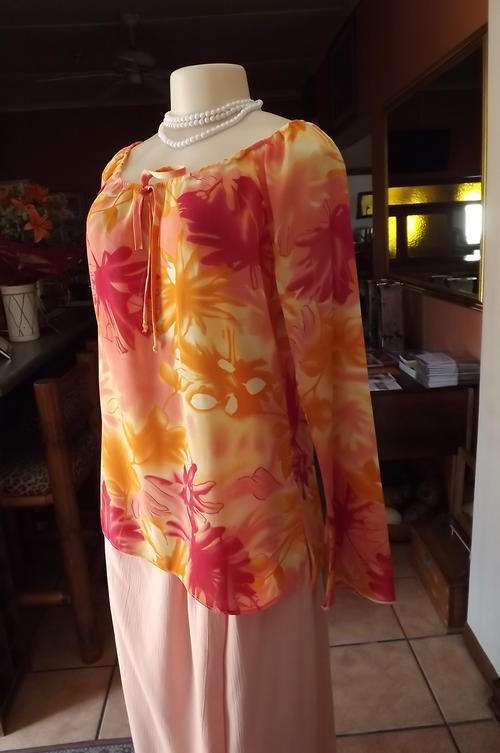 Lisa  spinelli top in bright orange and peach colours.Size 36/12.Round elasticated neckline.