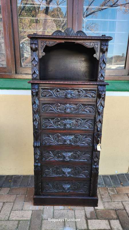 CARVED OAK JACOBEAN WELLINGTON CHEST