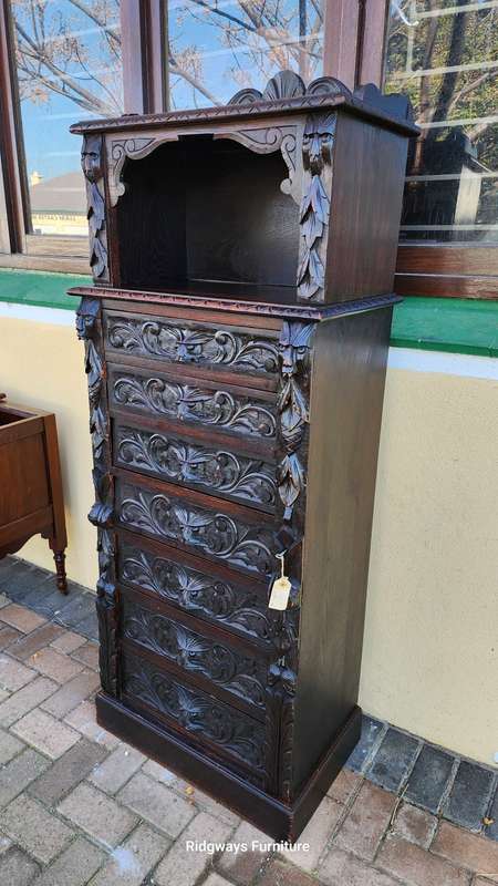 CARVED OAK JACOBEAN WELLINGTON CHEST