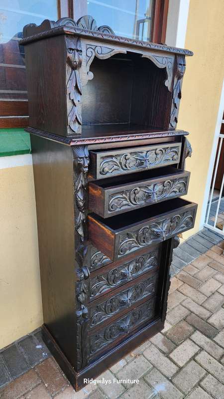 CARVED OAK JACOBEAN WELLINGTON CHEST